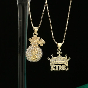 Hip hop crown and money bag pendant necklaces in gold plating with sparkling zircons