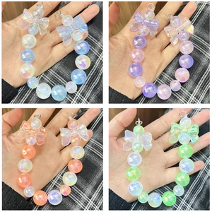UV luminous beaded keychain set with ribbon bows and iridescent glitter finish