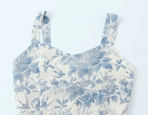 Detail of French vintage floral dress showing blue swallow print and slim fit strap neckline