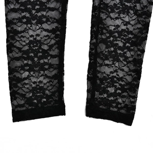 Close-up of intricate black lace patterns and hem finish on sheer bodysuit sleeve