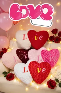Macro detail of heart plush pillows with Love embroidery and soft lamb wool texture