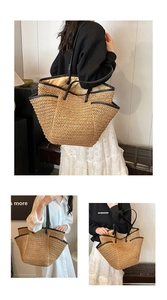 Detailed close-up showing straw weave texture and black leather trim on a large tote bag