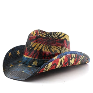 Detail of camouflage print straw cowboy hat with wide brim and yellow star accents