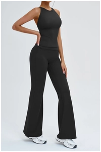 Detail of black sports set with hollow back vest and high waist flare yoga pants