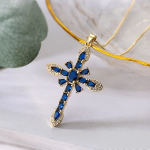 Exquisite 18K gold plated cross necklace featuring vibrant blue zircon gemstones