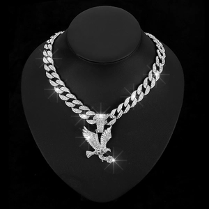 Hip hop silver eagle pendant necklace with sparkling crystals on black display