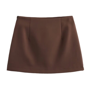 Detailed close-up of brown A-line mini skirt with high waist and concealed side zipper