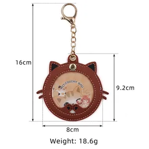 Brown cat-shaped badge holder accessory bag with clear window and gold keychain