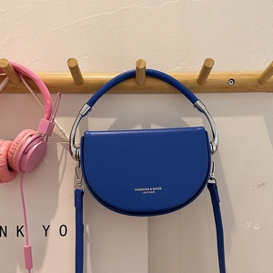 Blue semi-circle leather saddle bag with round handle and detachable shoulder strap