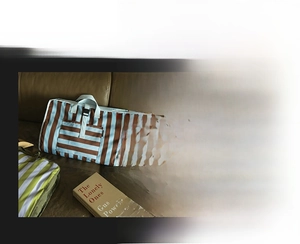 Detail of travel storage bags showing canvas stripe texture and washing instructions