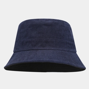 Close-up of dark blue corduroy fabric texture on a minimalist fisherman bucket hat