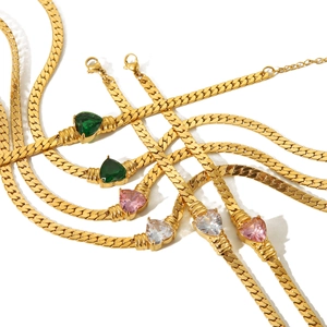 18K gold plated heart zircon bracelet set in green, pink and white on white background