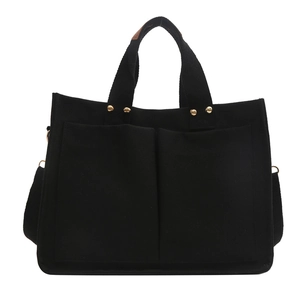 Large black canvas tote bag with double pockets and adjustable shoulder strap