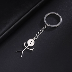 Polished stainless steel stick figure keychain with smiling face on black leather base