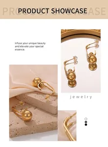 Detailed view of irregular gold-plated bead earrings with U-shaped hooks in high-end style