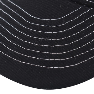 Detailed close-up of the black twill cotton cap brim with white contrast stitching lines