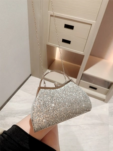 Elegant silver glitter evening bag with crown clasp and metal ring handle for weddings