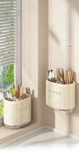Macro detail of wall-mounted kitchen utensil holder with drainage tray for cutlery