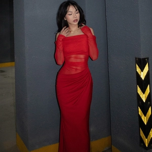 Detail of red off-shoulder long-sleeve mesh dress with elegant ruched fabric and hollow out design