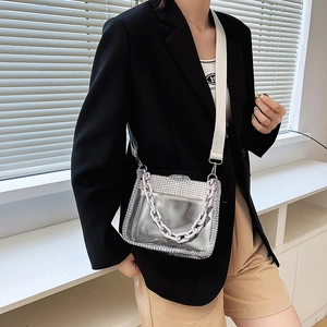 Transparent PVC crossbody bag with silver rhinestones and a chunky purple chain