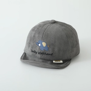 Close-up of soft grey suede baby cap featuring blue elephant embroidery and short brim