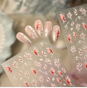 Detail showing red butterfly and white flower nail stickers with pearl relief accents