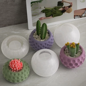 Detailed view of silicone molds for polka dot cube candle jars and succulent pots