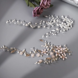 Detailed view of silver and gold bridal hair vines with pearls, crystals and flowers