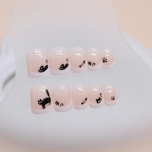 Short square press-on nails with cartoon black cat, fish bone and paw prints patterns