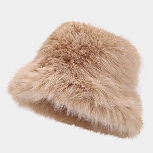 Close-up of fluffy faux fur texture on a warm light brown winter bucket hat for women