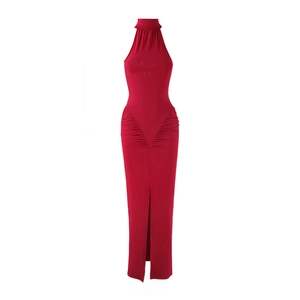 Detail of red halter neck dress featuring ruched waist and front slit design