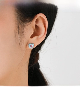 Detail of S925 silver heart stud earrings with blue enamel and pink zircon stone