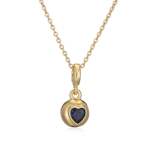 Close-up of a gold-plated spherical pendant necklace with a blue heart-shaped cubic zirconia