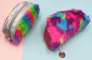 Close-up of fluffy rainbow plush pencil case with holographic silver zipper and metal puller