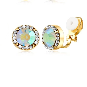 Macro detail of gold clip-on earrings with colorful center stone and white cushion padding