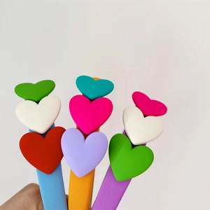 Detail of colorful sponge headbands for kids with vibrant fabric heart decorations