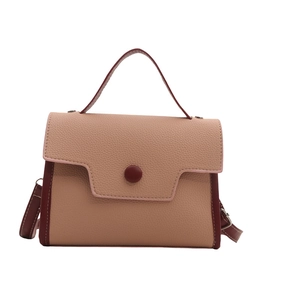 Pink and burgundy patchwork faux leather crossbody bag with top handle and pebble texture