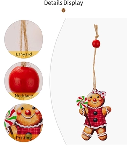 Detail view of gingerbread man ornament showing lanyard, red bead, and printing quality
