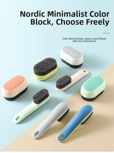 Close-up of assorted multi-purpose cleaning brushes with soft bristles and ergonomic handles