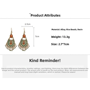 Detail view of vintage boho earrings with seed bead tassels and size specifications
