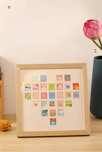 Macro detail of wooden grid photo frame featuring heart-shaped DIY miniature 3D art