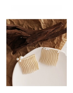 Close-up of gold hair combs set featuring elegant pearls and sparkling rhinestones