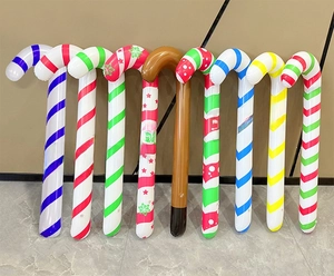 Various colorful Christmas inflatable walking sticks in striped and patterned festive designs