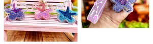 Detail of creative cherry blossom starfish oil liquid keychain with silicone wristband