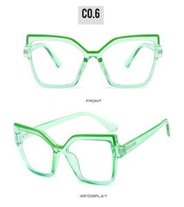 Front and 45-degree views of translucent light green geometric cat-eye eyeglass frames