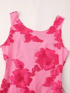 Detailed close-up of pink rose ribbon embroidery on a sleeveless mesh dress