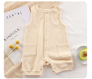 Detailed view of beige ribbed baby romper featuring front buttons and snap crotch