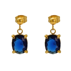 Detail of gold-plated geometric earrings with oval deep blue zircon stone inlays