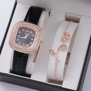 Detail of rose gold square watch with crystal bezel and matching floral bracelet in gift box