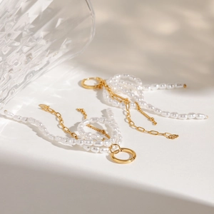 Elegant 18k gold stainless steel hoop earrings with white baroque pearl tassels and bows